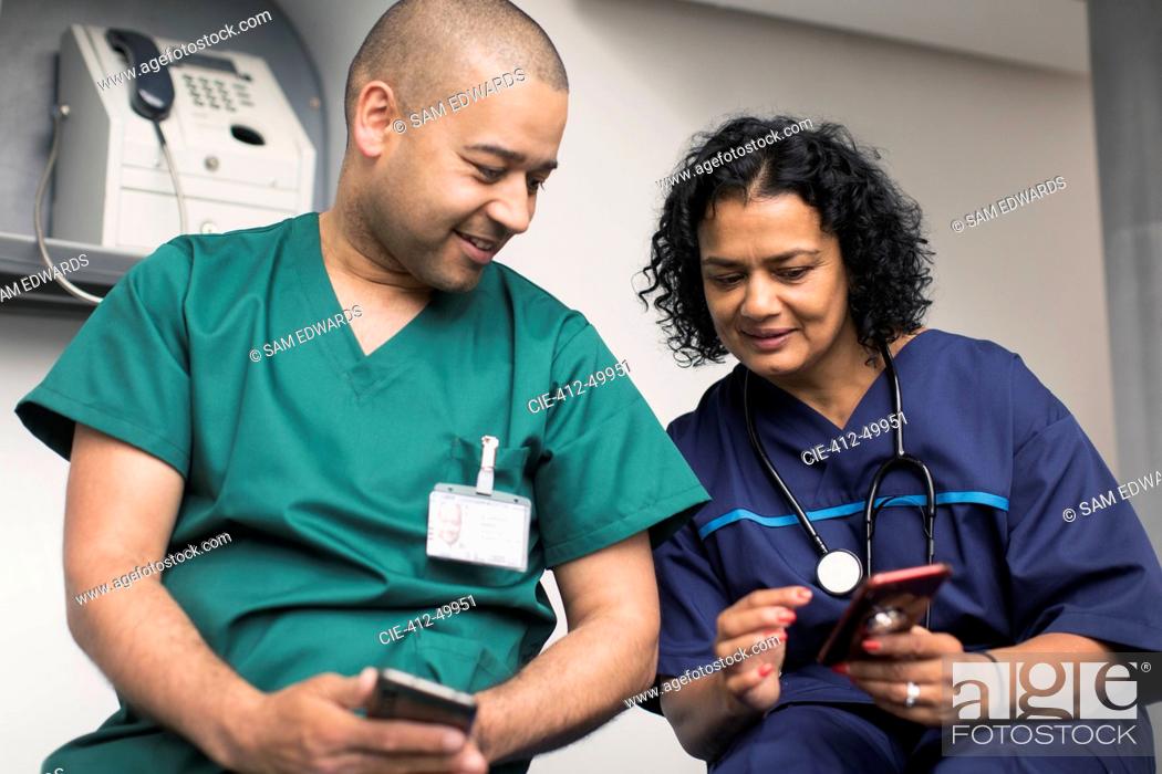 Stock Photo: Doctor and surgeon using smart phones.