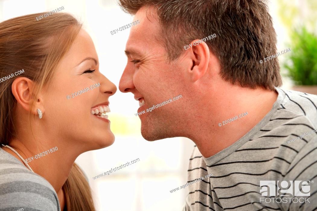 Stock Photo: Loving couple laughing at each other in closeup.