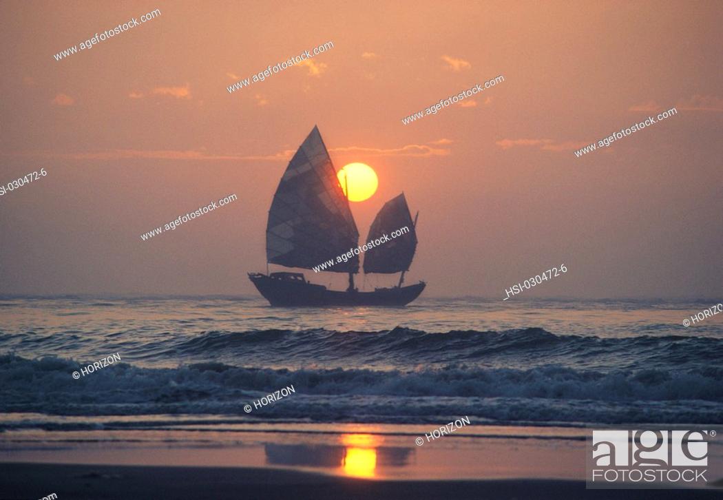 Stock Photo: Sailboat on at sunrise near Shantou, Canton, China.