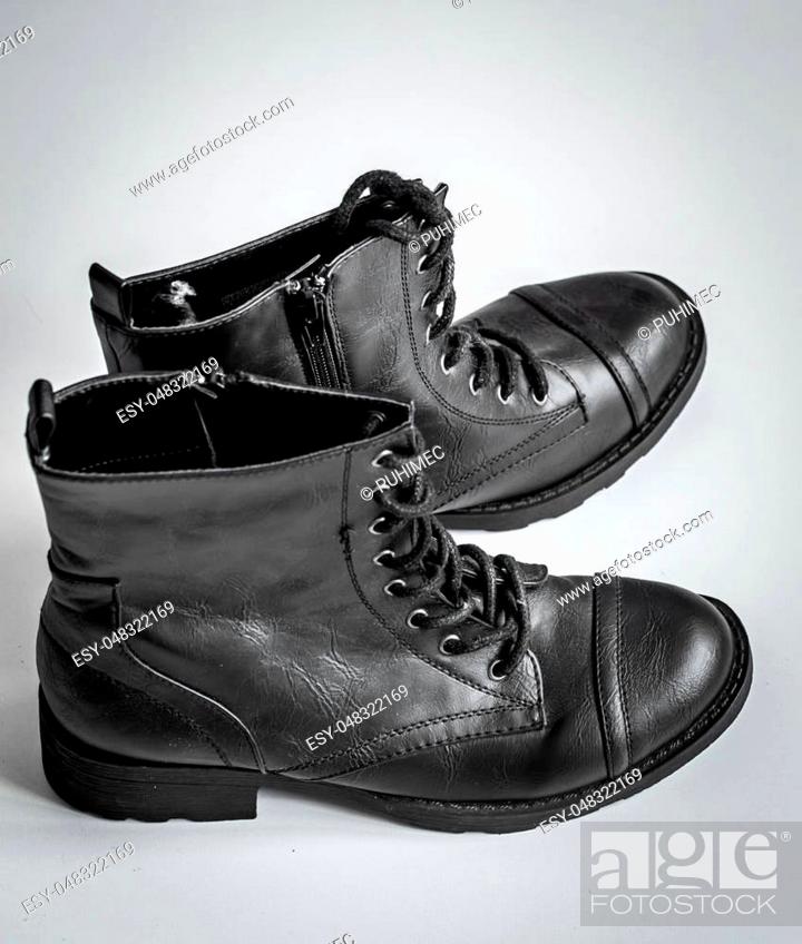 Stock Photo: black high boots on a white background.