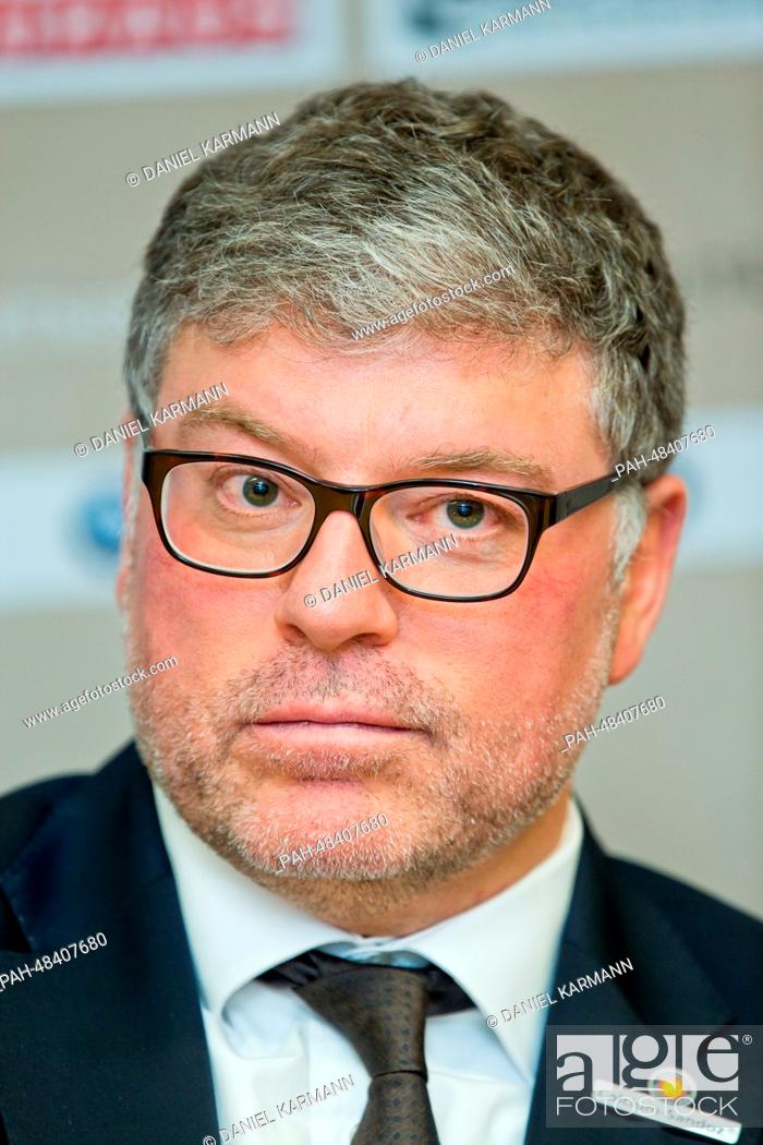 Stock Photo: German coach Pat Cortina is pictured during a press conference after the ice hockey friendly match Germany vs USA in Nuremberg, Germany, 06 May 2014.