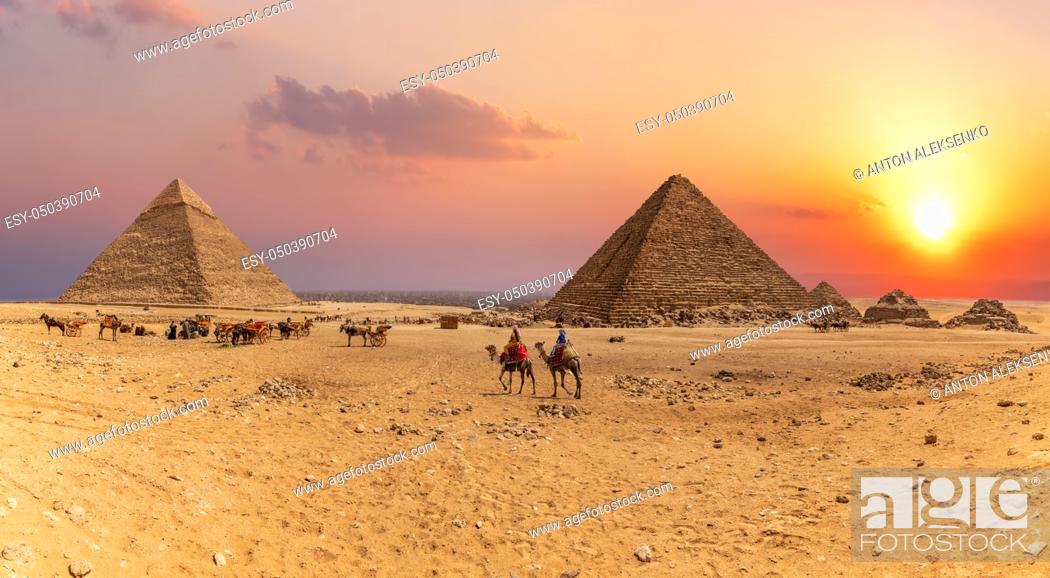 Stock Photo: Sunset panorama of the Great Pyramids of Giza, Egypt.