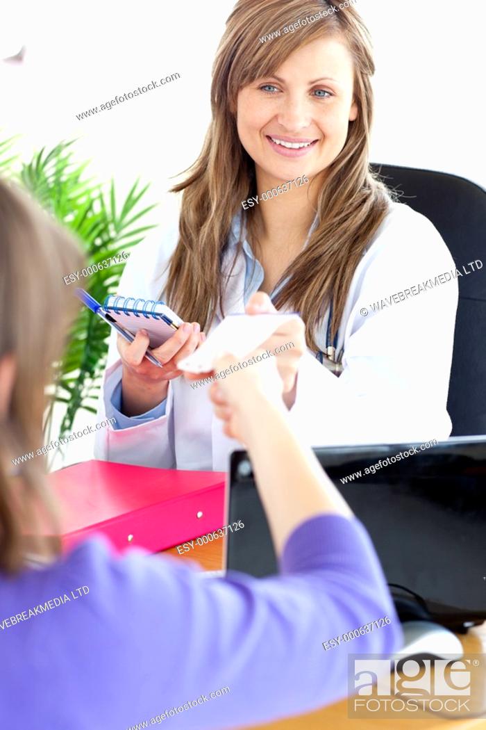 Stock Photo: Self-assured female doctor doing a diagnosis in her office.