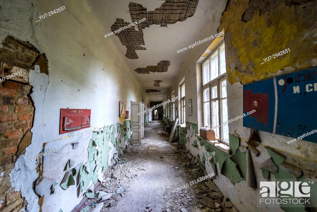 Stock Photo: Corridor in old secondary school in Mashevo abandoned village of Chernobyl Nuclear Power Plant Zone of Alienation in Ukraine.