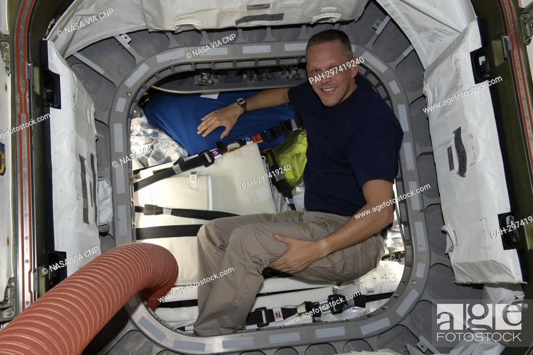 Stock Photo: NASA astronaut and Expedition 67 Flight Engineer Bob Hines is pictured inside the vestibule between the Unity module and the Cygnus space freighter finalizing.