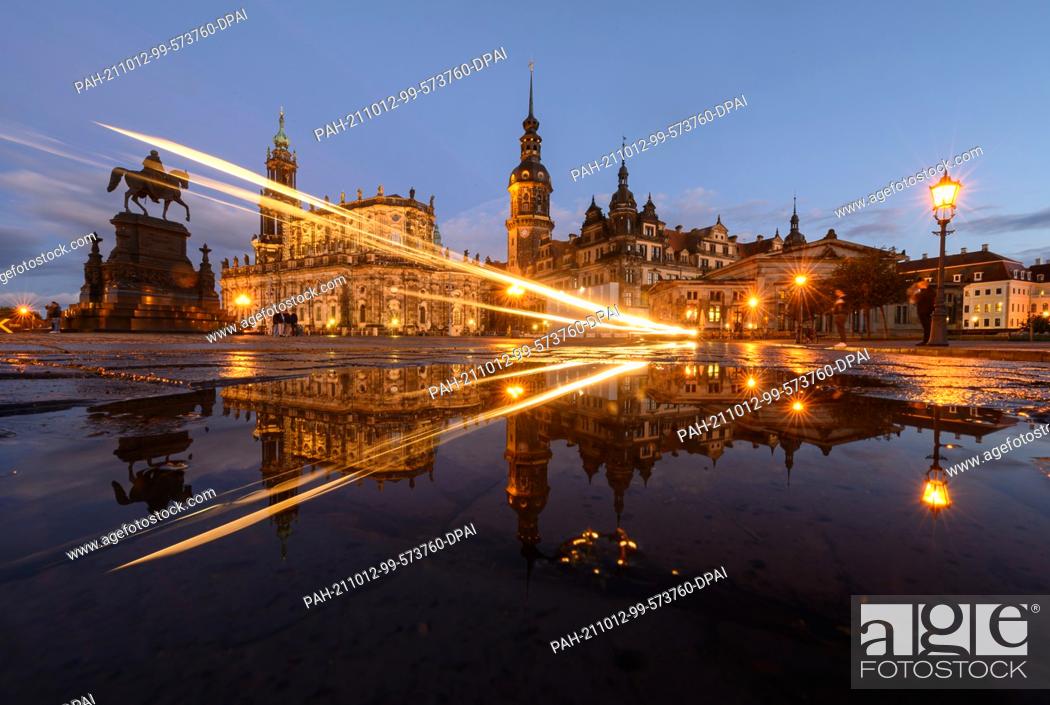 Stock Photo: 12 October 2021, Saxony, Dresden: The equestrian statue of King Johann (l-r), the Hofkirche, the Hausmannsturm, the Residenzschloss and the Schinkelwache are.