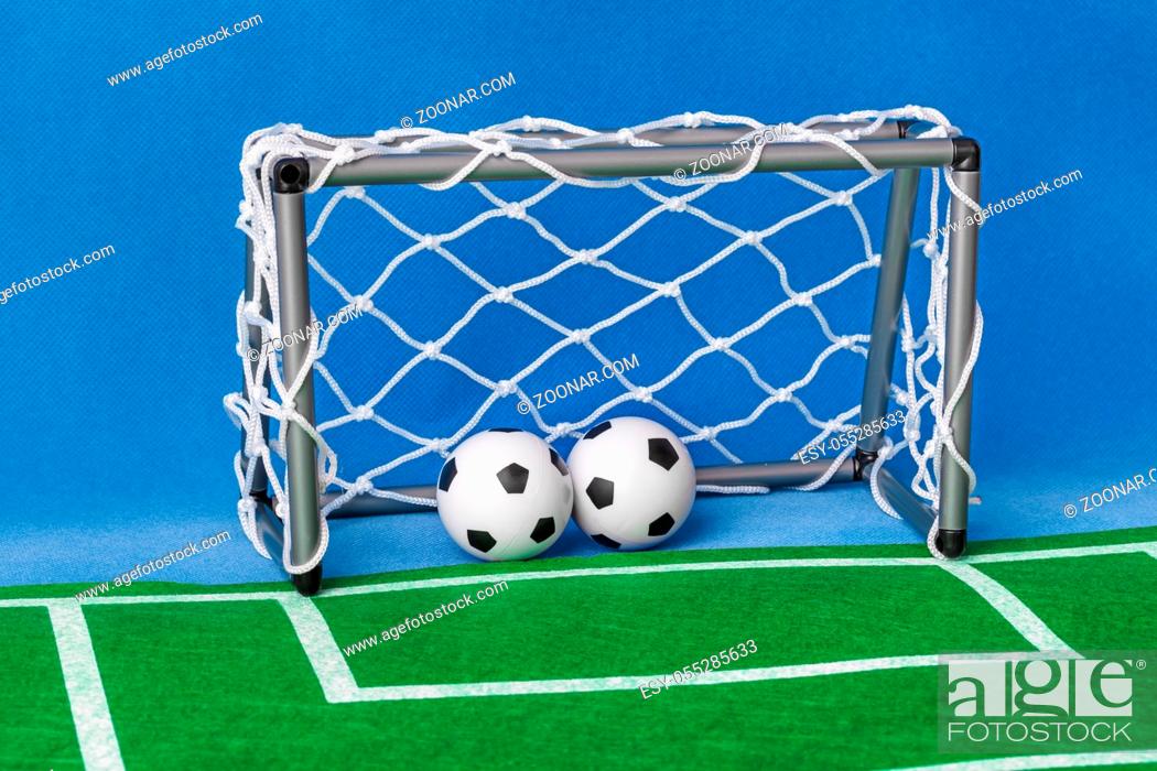 Stock Photo: Toy football field and gate - sport background.