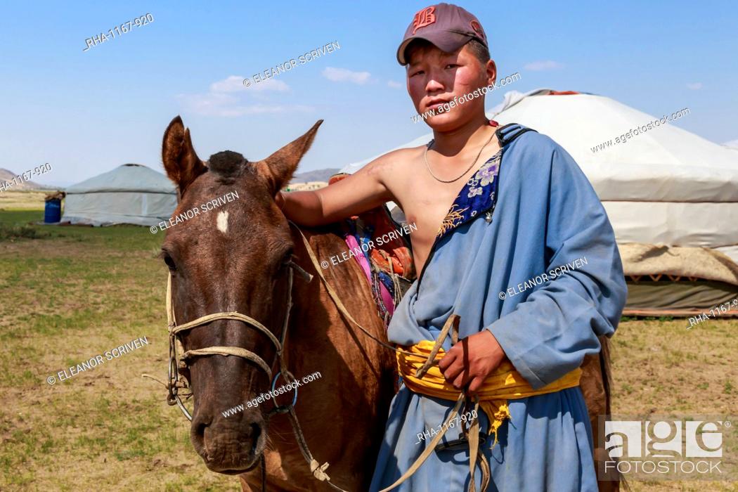 Stock Photo: Portrait of nomad in deel with his horse, Nomad gers, Khogno Khan Uul Nature Reserve, Gurvanbulag, Bulgan, Northern Mongolia, Central Asia, Asia.