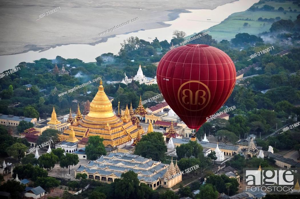 Stock Photo: Hot air balloon at dawn over the Shwezigon Pagoda in Bagan, Myanmar, Burma, Southeast Asia, Asia.