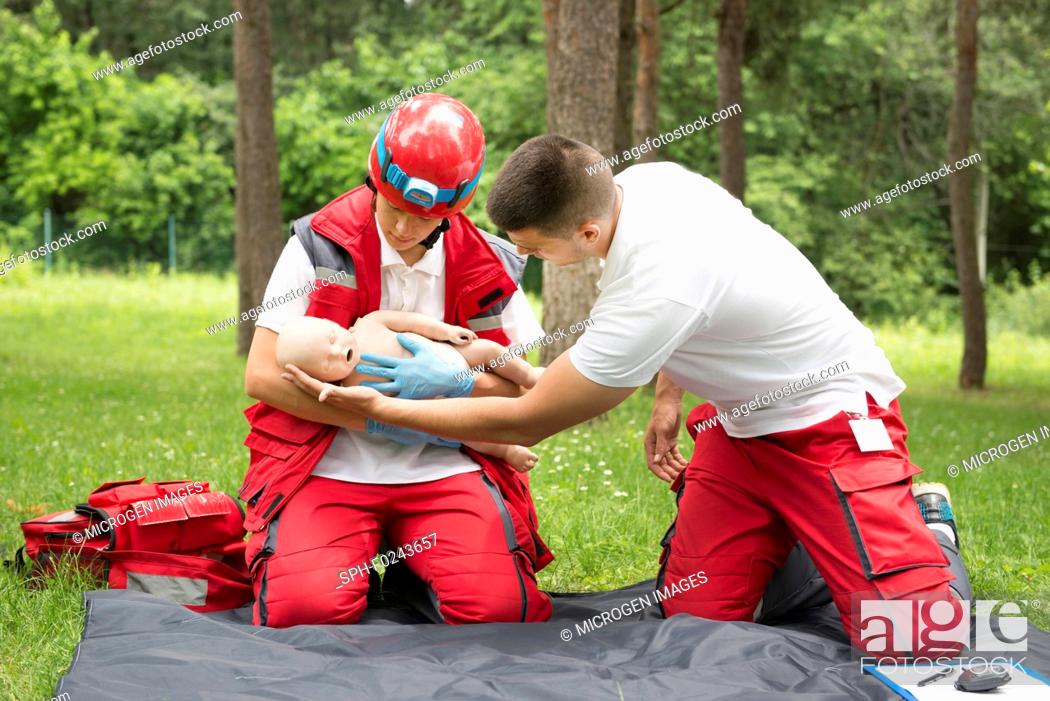 Stock Photo: CPR training on baby dummy.