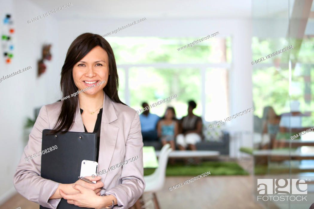 Stock Photo: Real estate agent showing family new home.