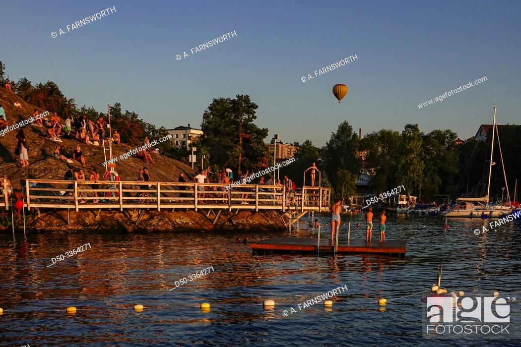 Stock Photo: Stockholm, Sweden A public bathing area on Lake Malaren called Ornsbergs Klippbad, and hot air balloon.