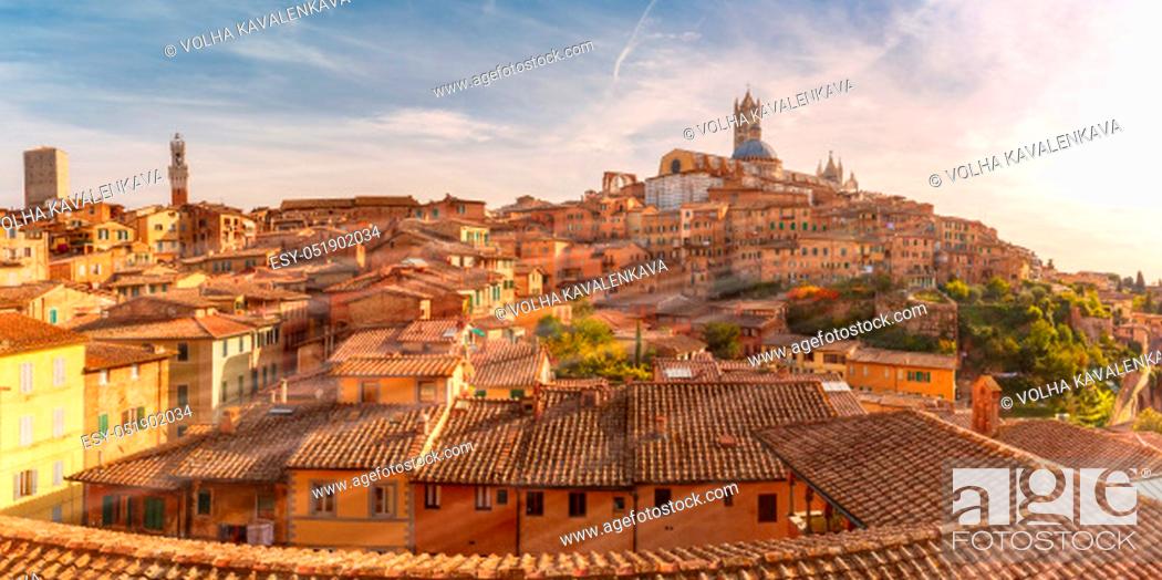 Stock Photo: Beautiful panoramic view of Old Town with Dome and campanile of Siena Cathedral, Duomo di Siena, and Mangia Tower or Torre del Mangia at sunset, Siena, Tuscany.