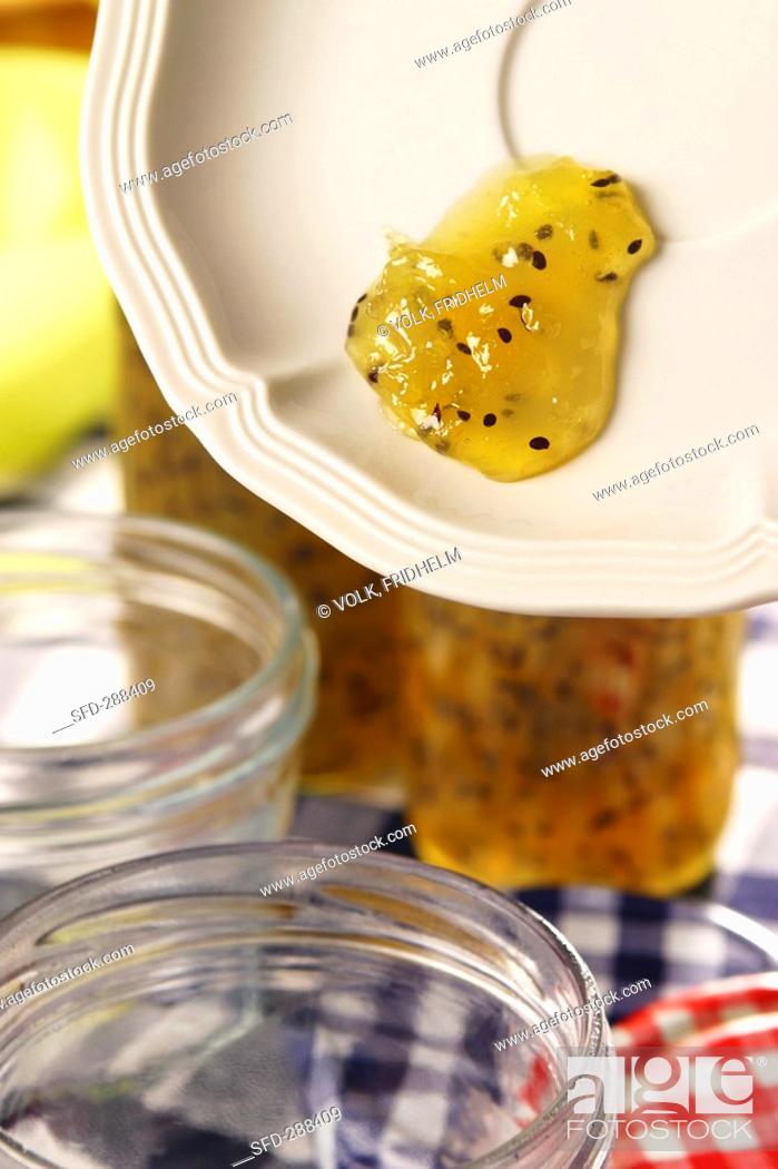 Stock Photo: Testing for setting point of kiwi fruit jam.