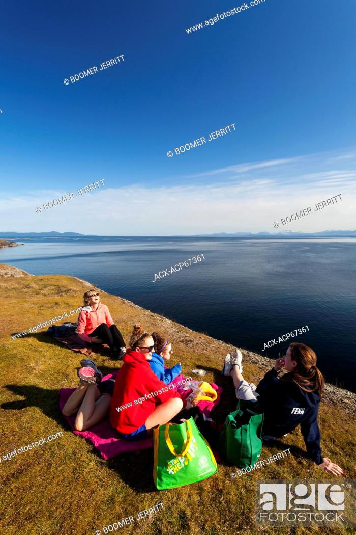 Stock Photo: A family outing turns to laughter while having lunch along the cliffs of Helliwell on Hornby Island. Hornby Island, Northern Gulf Island's, British Columbia.