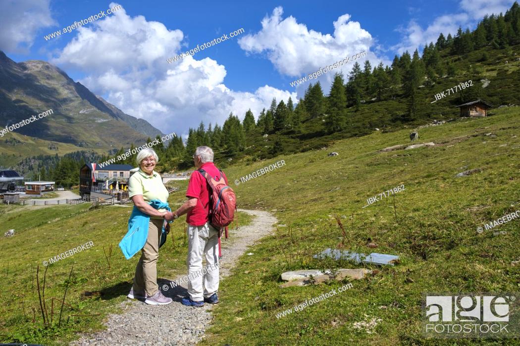 Stock Photo: Hikers, senior citizens at the Grünbodenalm, Grünbodenhütte, Pfelders, Pfelderer Tal, Texel Group nature Park, South Tyrol, Italy, Europe.