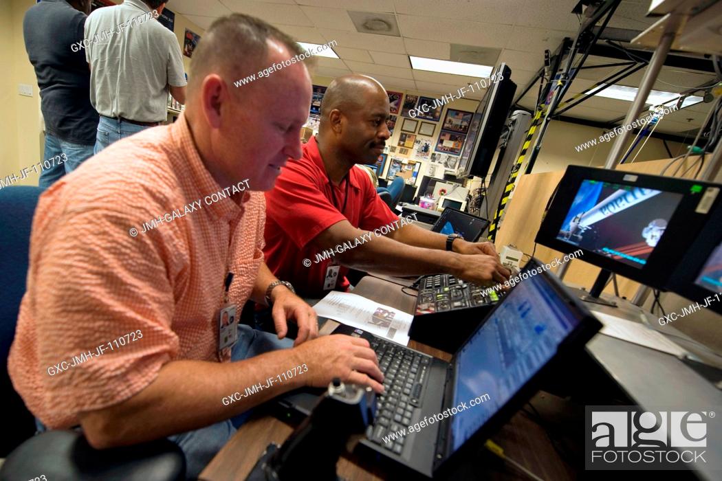 Stock Photo: Astronauts Barry Wilmore (foreground), STS-129 pilot; and Leland Melvin, mission specialist, use the virtual reality lab in the Space Vehicle Mock-up Facility.