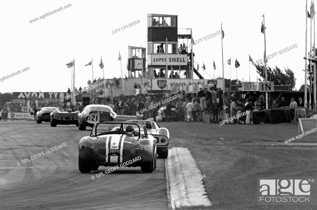 Stock Photo: Goodwood. No23 Jack Sears' Willment Cobra, No 8 Denny Hulme's Brabham BT8 Climax in the Goodwood RAC TT, England 29th August 1964.
