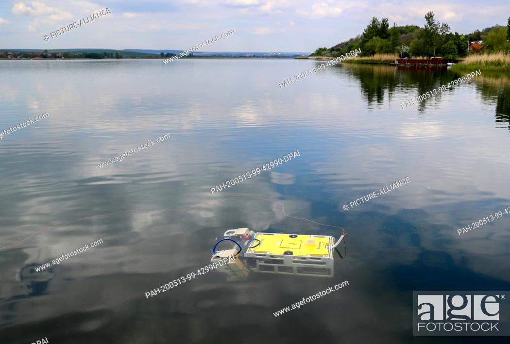 Stock Photo: 13 May 2020, Saxony-Anhalt, Seegebiet Mansfelder Land: A diving robot with a high-resolution 3D laser swims in the sweet lake.