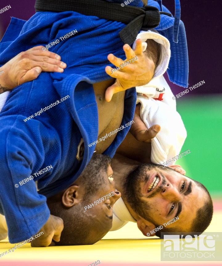 Stock Photo: Belgium's Toma Nikiforov (white) competes in the Men's -100kg Bronze Medal Final with Jorge Fonseca of Portugal at the Baku 2015 European Games in Heydar Aliyev.
