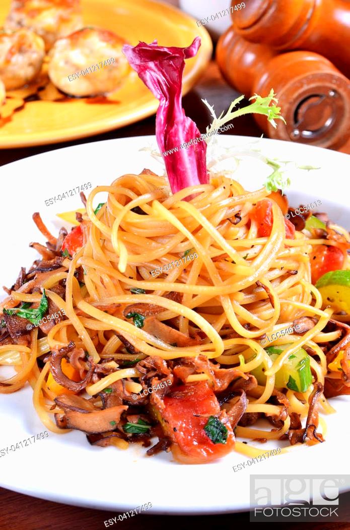 Stock Photo: Linguini with wild mushrooms on white plate.