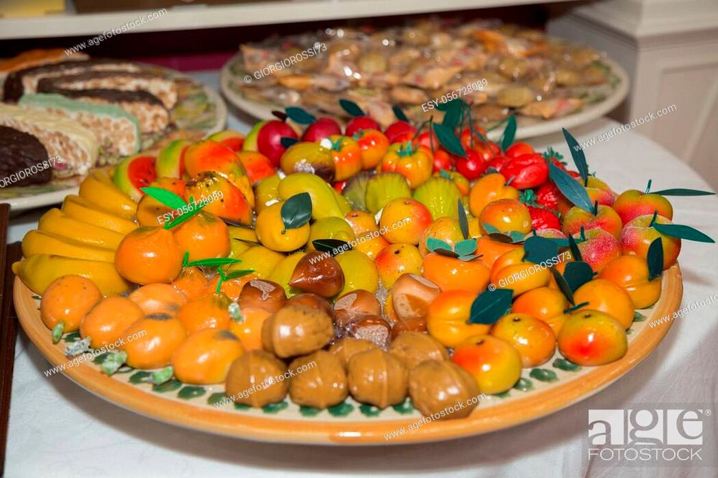 Stock Photo: Small Marzipan Sweets in the Shape of Fruit Arranged on a Round Plate.