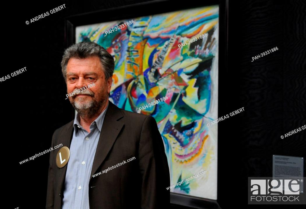 Stock Photo: Museum director Helmut Friedel poses in front of Kandinsky's painting 'Improvisation Klamm' during the re-opening of Lenbachhaus in Munich,  Germany.