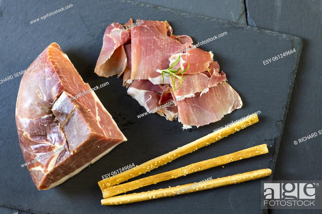 Stock Photo: Italian ham served with grissini.