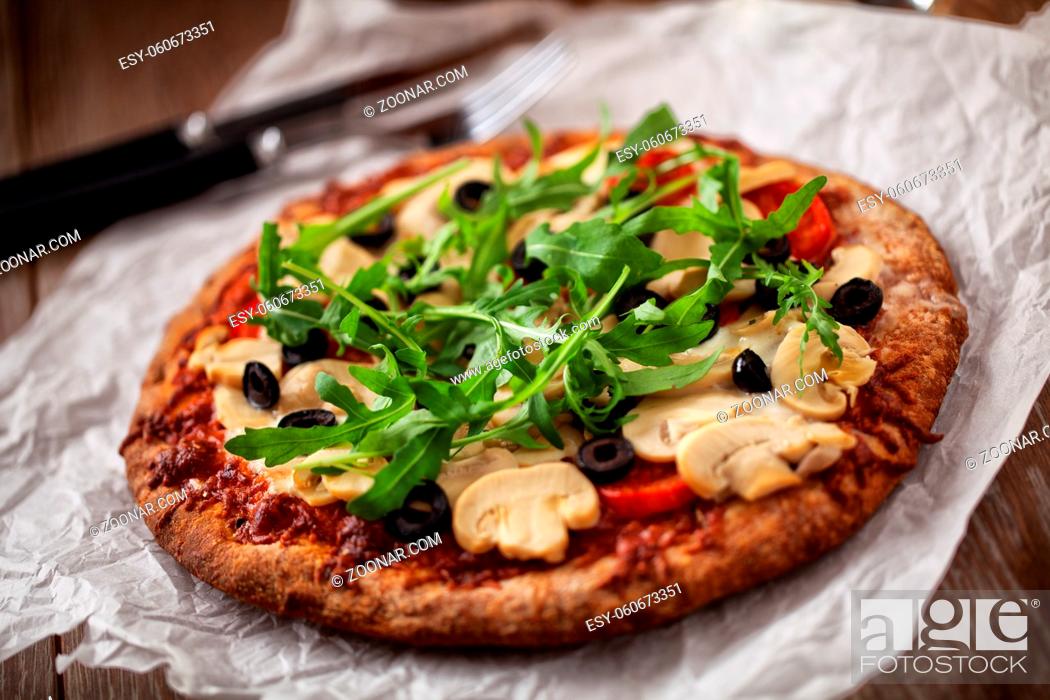 Stock Photo: Pizza with Cheese, Tomatoes, Champignon, Olives and Arugola.