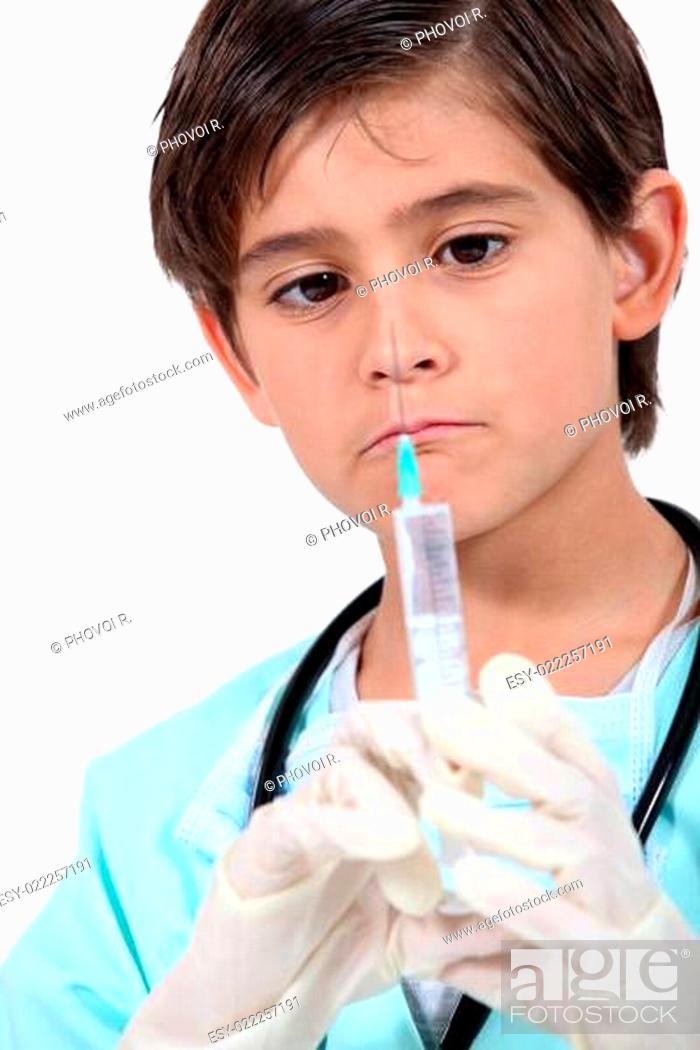 Stock Photo: Little boy with syringe dressed as doctor.