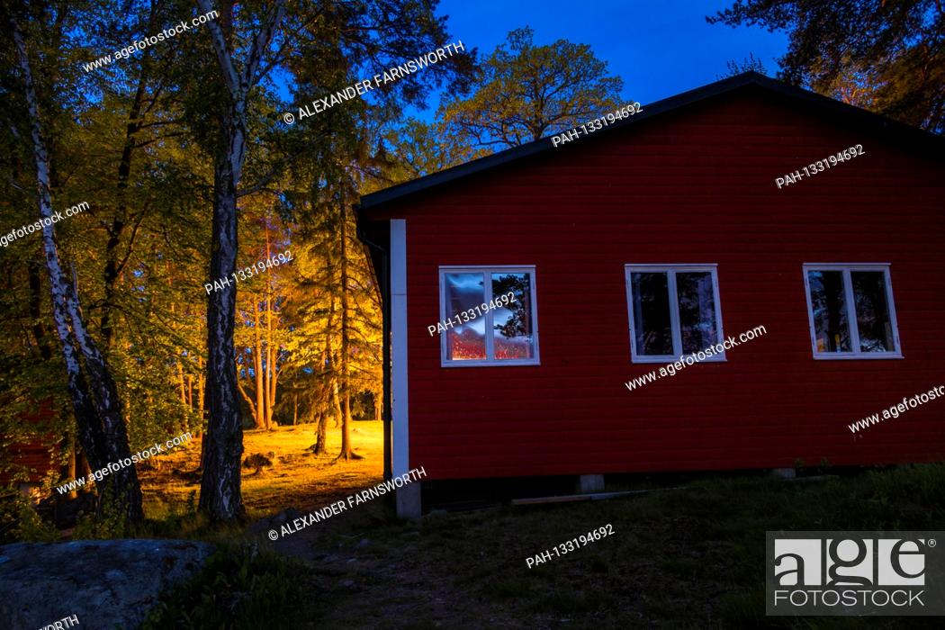 Stock Photo: Stockholm, Sweden A red house at night on the Idskar island in Lake malaren. | usage worldwide. - STOCKHOLM/Sweden.