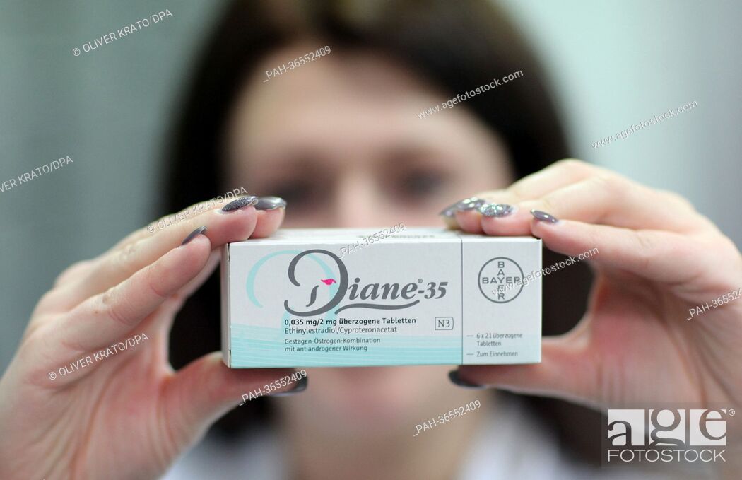 Stock Photo: A pharmaceutical assistant holds a pack of the contraceptive Diane 35 in Luebbecke, Germany, 30 January 2013. The acne medicine by Bayer often prescribed as a.