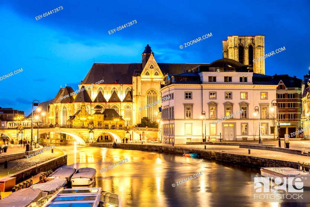 Stock Photo: Picturesque medieval buildings on Leie river in Ghent town, Belgium at dusk.