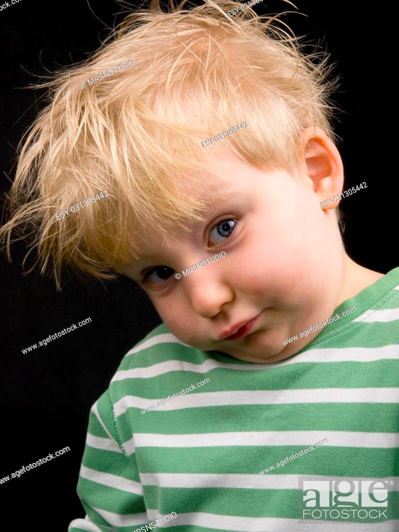Little boy making funny face on black background. Boy have blue eyes and  blond hair and have a bit..., Stock Photo, Picture And Low Budget Royalty  Free Image. Pic. ESY-031305442 | agefotostock