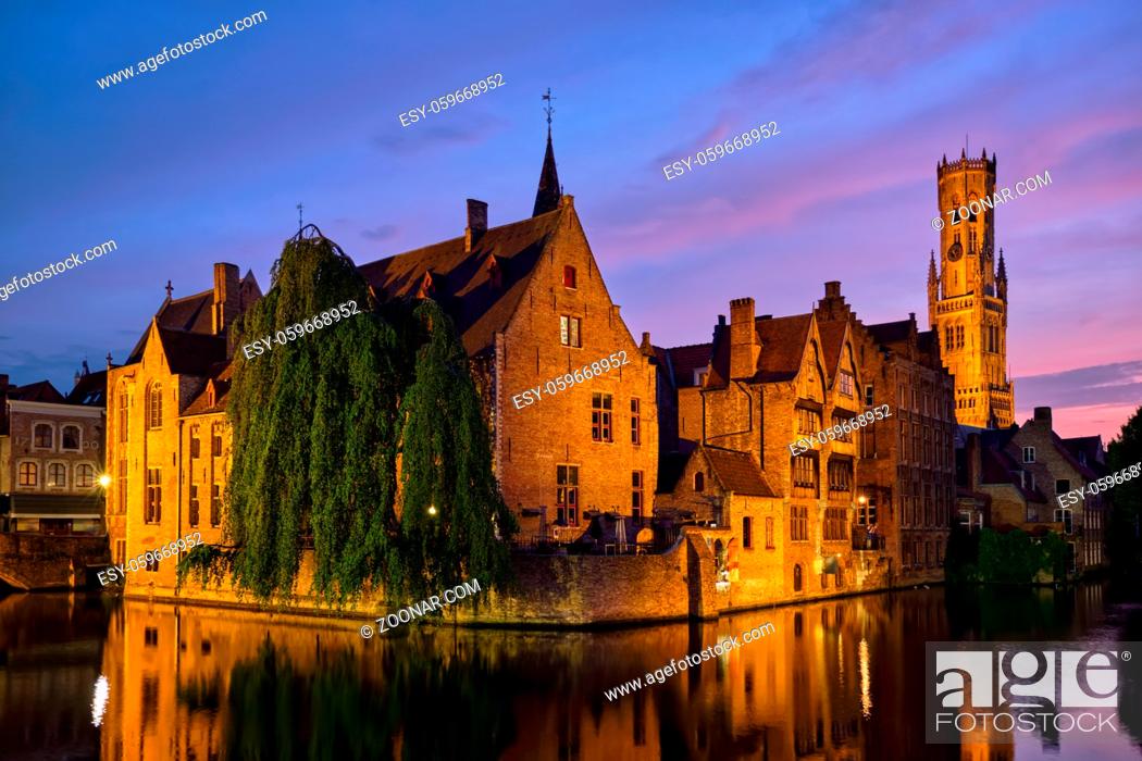 Stock Photo: Famous view of Bruges tourist landmark attraction - Rozenhoedkaai canal with Belfry and old houses along canal with tree in the night. Brugge, Belgium.