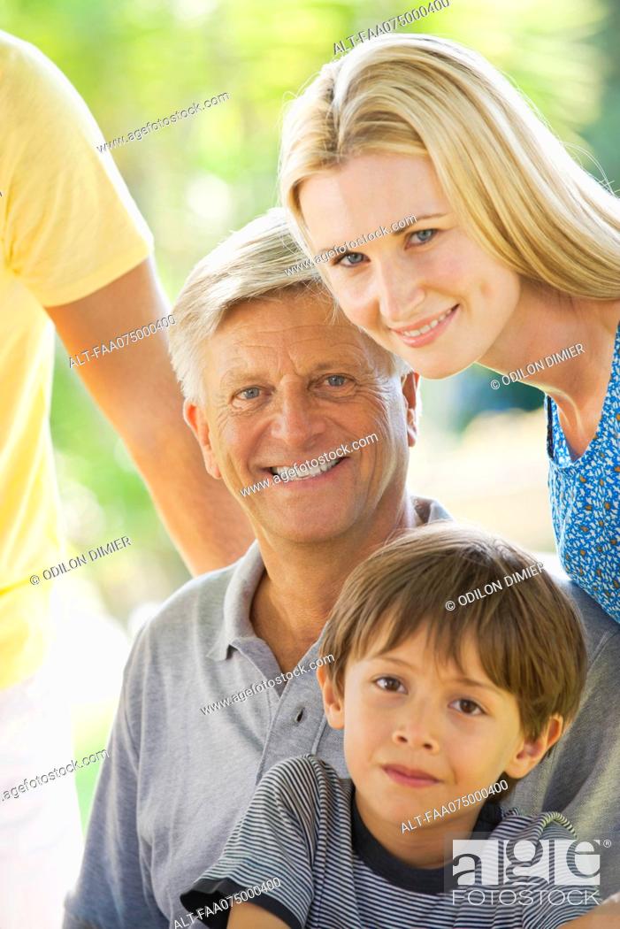 Stock Photo: Senior man with adult daughter and grandson, portrait.