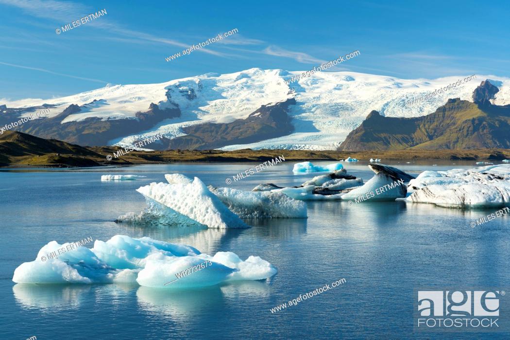 Stock Photo: Icebergs floating on Jokulsarlon Glacial Lagoon with Hvannadalshnukur Peak in the background, Iceland, Polar Regions.