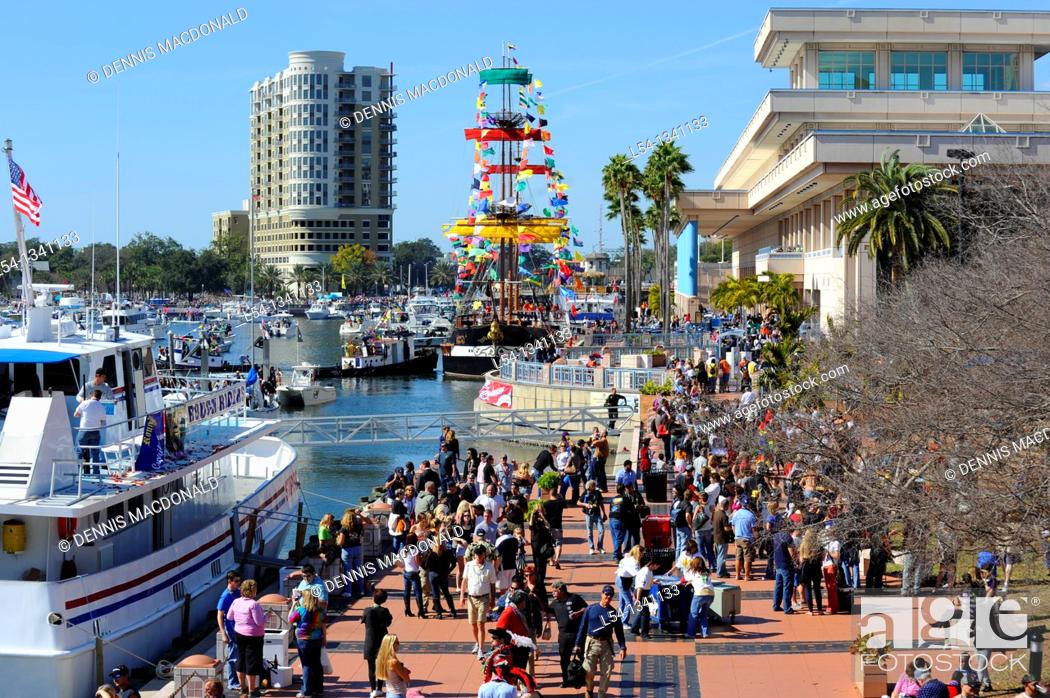Stock Photo: Crowd with boats downtown Tampa Gasparilla Pirate Festival.