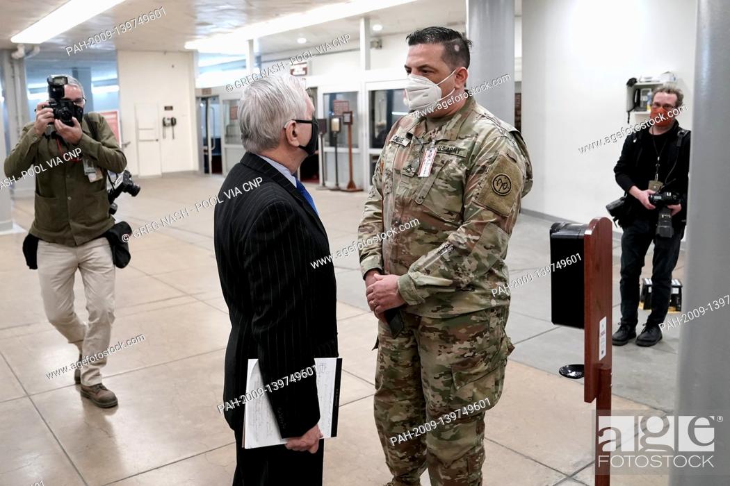 Stock Photo: Sen. Jack Reed (D-R.I.) speaks to a National Guardsman as he arrives at the Capitol on Wednesday, February 10, 2021 for the second day of the impeachment trial.