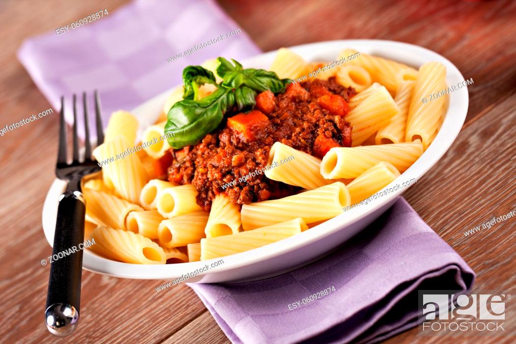 Stock Photo: Macaroni Bolognese on a plate. Typical Italian dish. High quality photo.