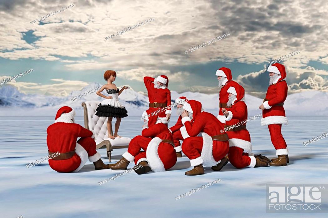 Stock Photo: Girl standing on chair lecturing Santas.