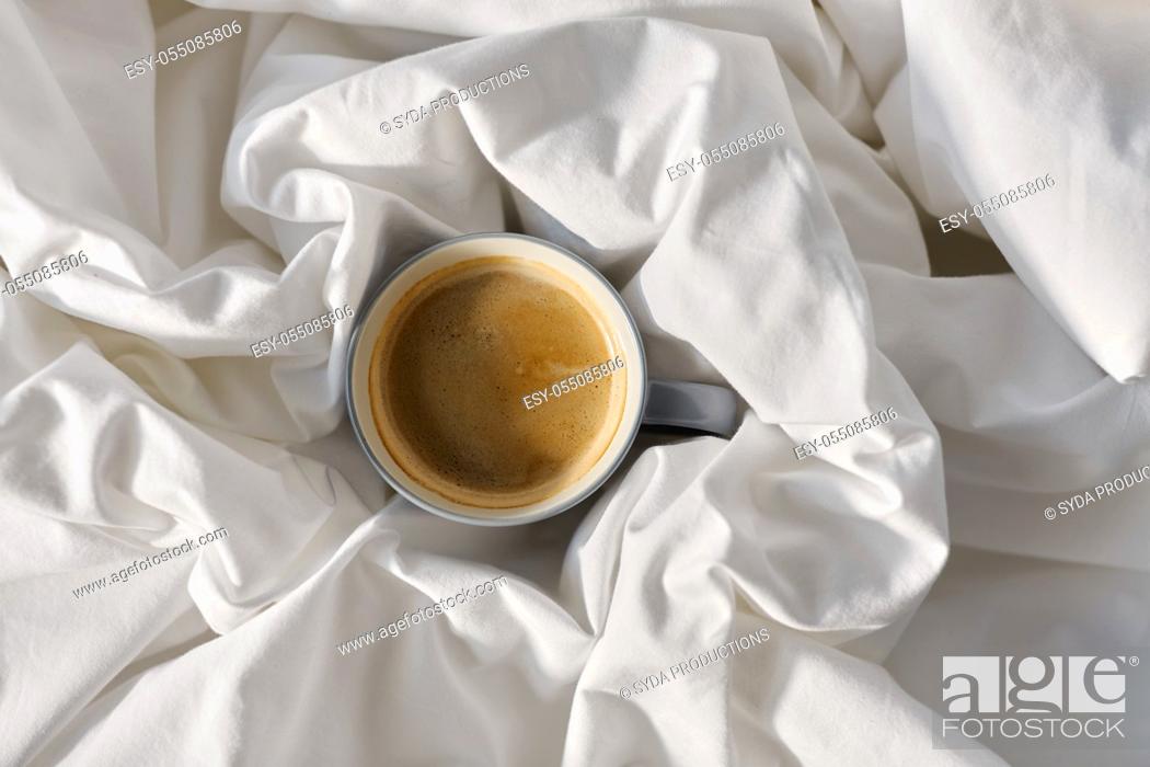 Stock Photo: cup of coffee in bed.