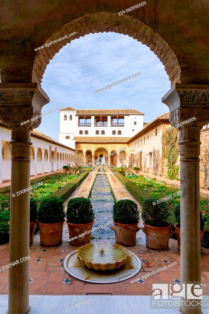 Stock Photo: Granada, Spain - 5 February, 2021: the Generalife Palace with the Patio de la Acequia in the Alhambra in Granada.
