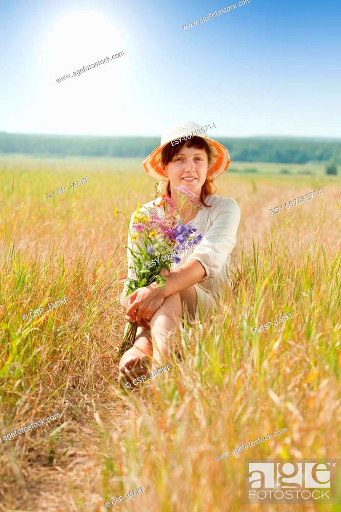 Stock Photo: girl in summer field.