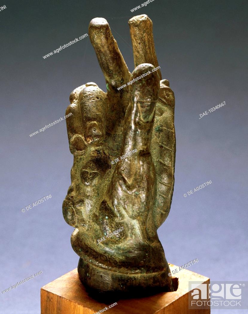 Stock Photo: Hand-shaped bronze amulet with apotropaic symbols. Roman Civilisation.  Brescia, Museo Civico Dell'Età Romana E Tempio Capitolino (Archaeological Museum).