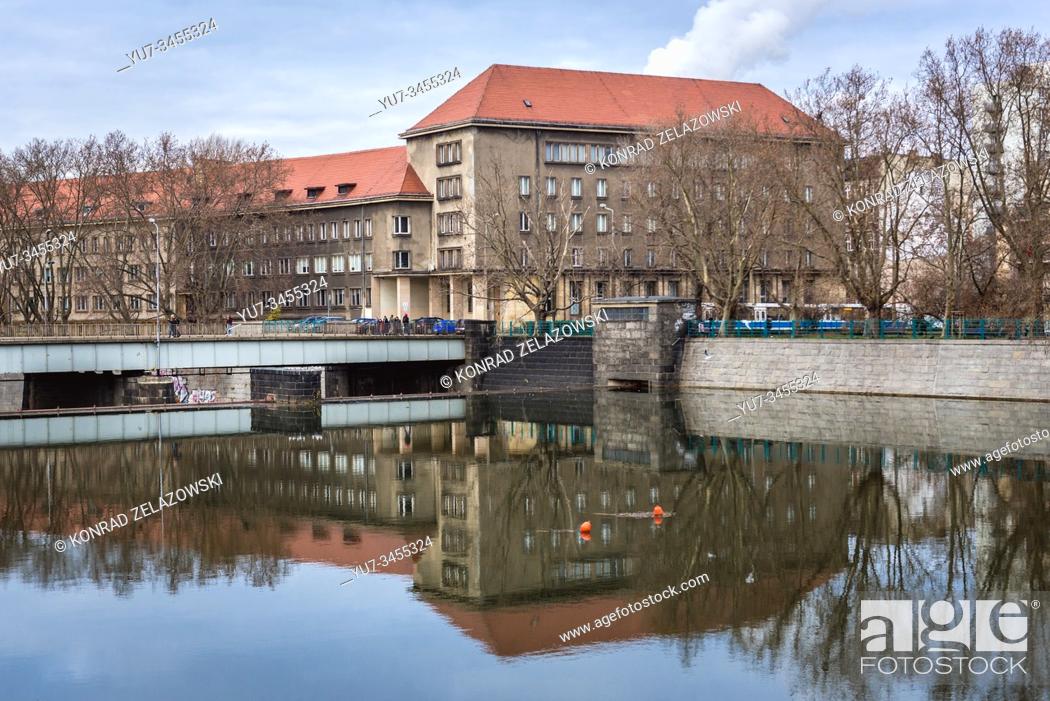 Stock Photo: View from Kepa Mieszczanska Isle on the Oder river with State Archives and University building in Wroclaw, Silesia region of Poland.