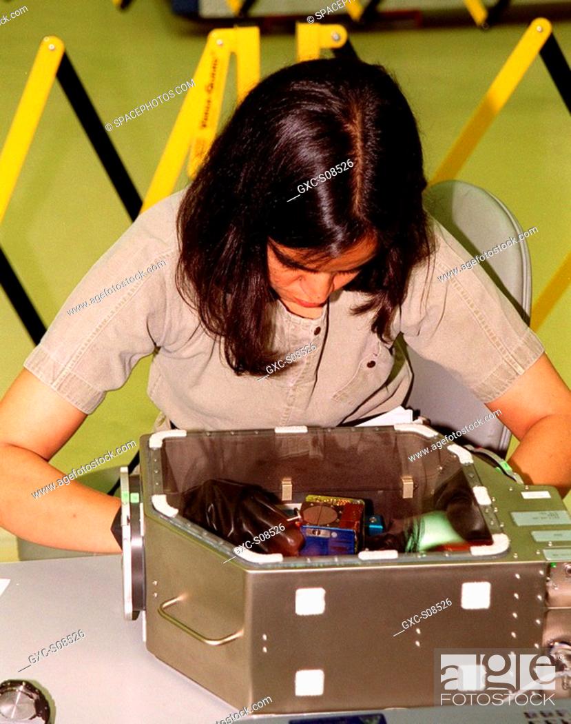 Stock Photo: 06/14/2001 -- During Crew Equipment Interface Test activities at SPACEHAB, Cape Canaveral, Fla., STS-107 Mission Specialist Kalpana Chawla trains on a glove box.