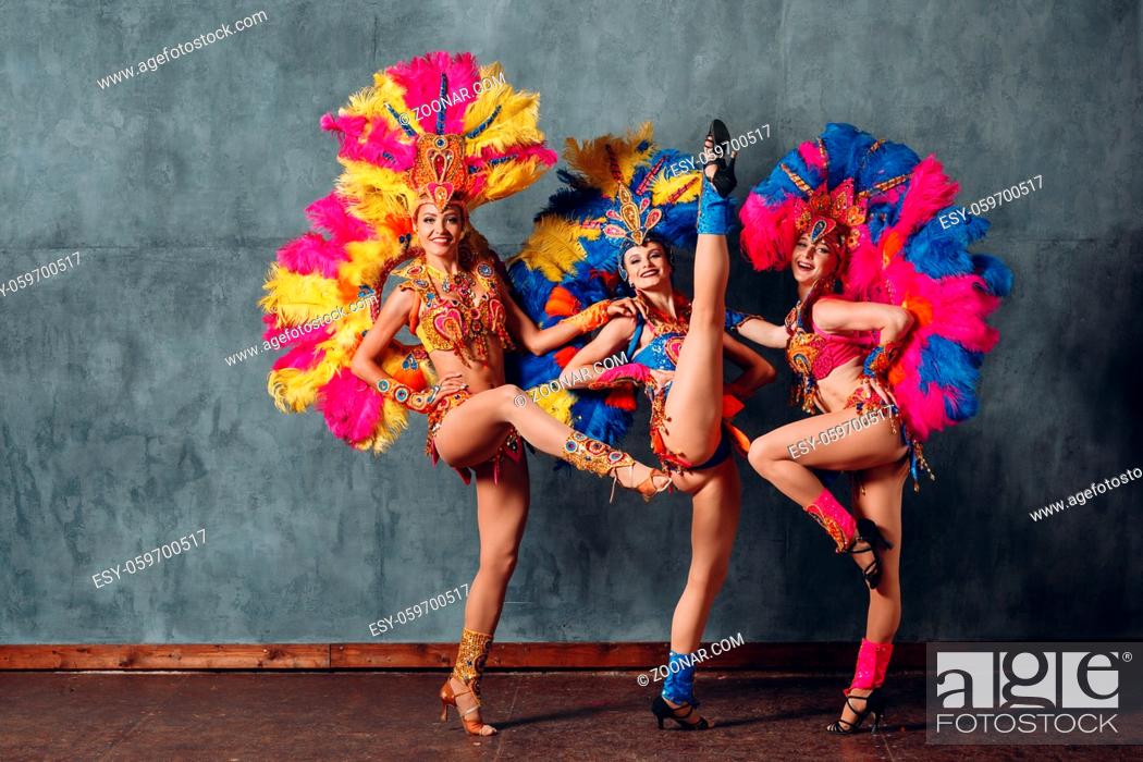 Stock Photo: Three Woman in cabaret costume with colorful feathers plumage.
