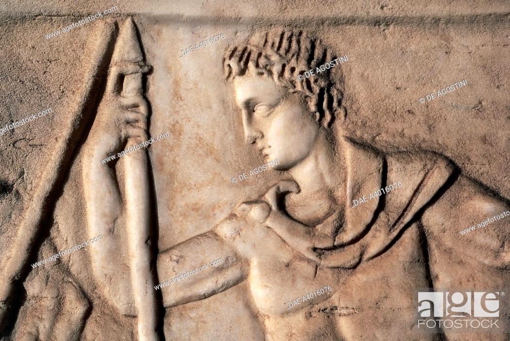 Stock Photo: Nude Ephebos wearing a chlamys and holding a hunting spear, relief, side wall of a sarcophagus decorated with scenes of the myth of Hippolytus and Phaedra.