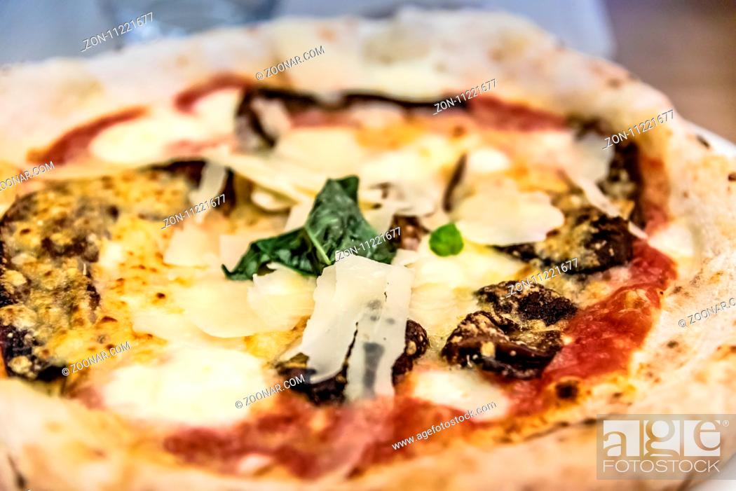 Stock Photo: Vegetables pizza in restaurant. Close up shot with narrow depth of field.